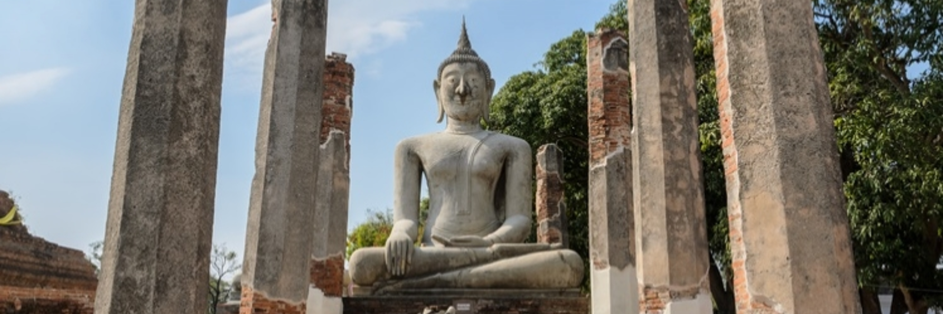THE ANCIENT BUDDHA STATUE. WAT MAHATHAT, CHAINAT